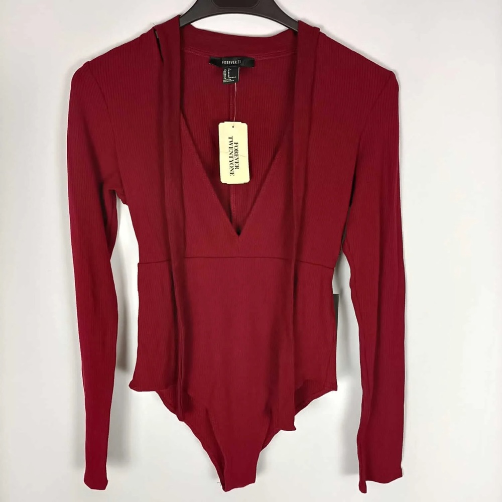 NWT Forever21. Burgundy ribbed body with lacing detail on the neck.
